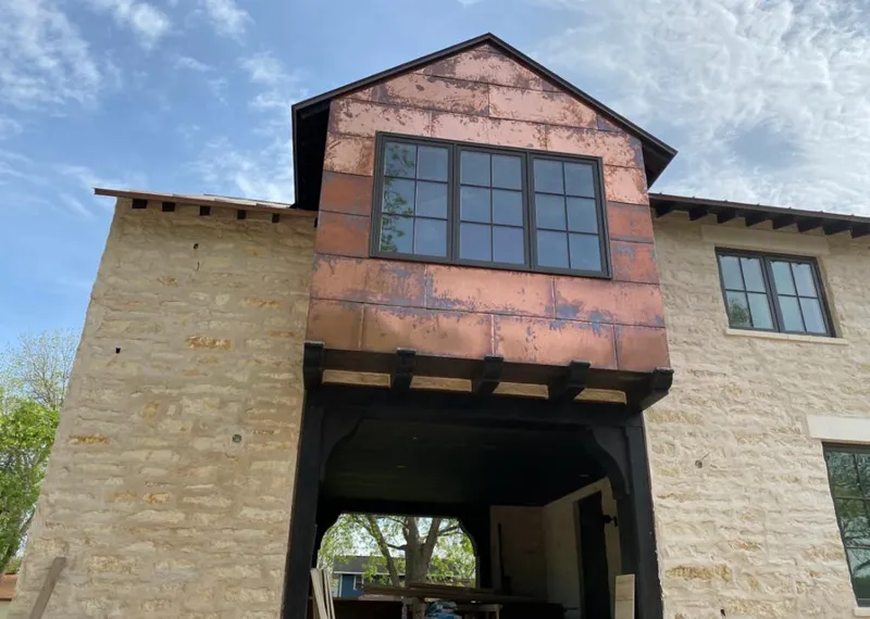 Copper metal panel facade on a stone building for Skylight Installation in South Lebanon
