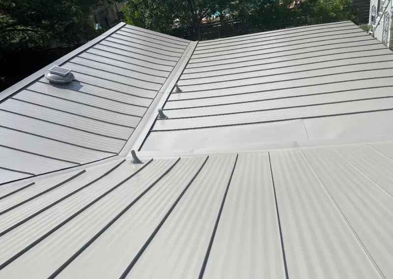 Solar attic fan installed on a metal roof for Roof Ventilation in South Lebanon